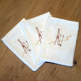 White washcloths with a ski...
