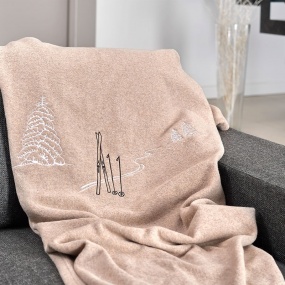 Taupe blanket with ski marks