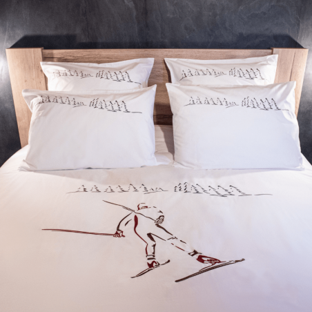 Housse de couette en percale de coton blanche brodée d'un motif skieur