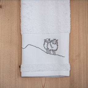 White bath towel with sheep