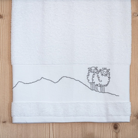 Mountain bath sheet embroidered with a sheep motif.