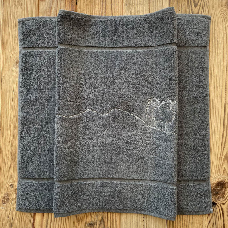 Grey bath mat with a sheep 20 x 31 in