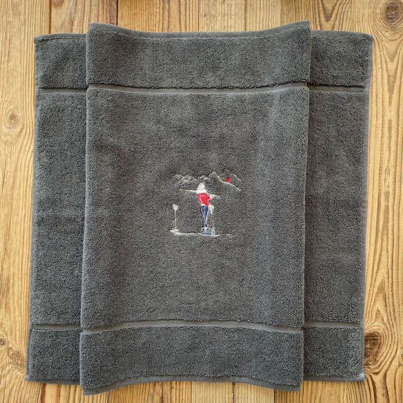 Grey bath mat with a Champion 20 x 31 in