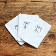 Three washcloths embroidered with a grey sheep motif.