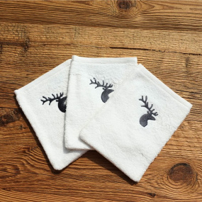 White washcloth with a deer...