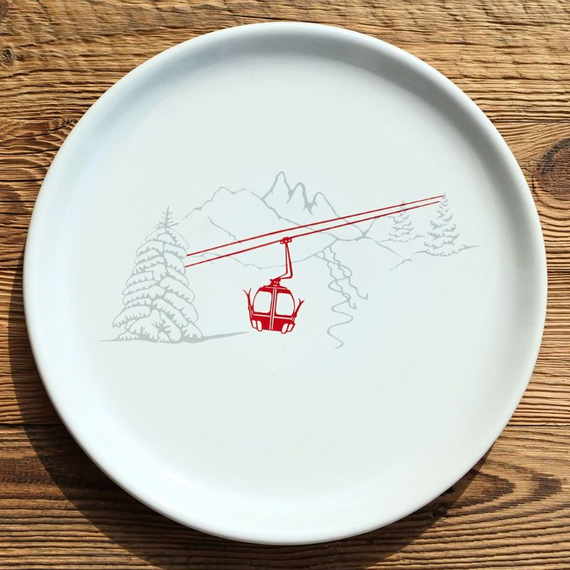 Mountain serving platter with a gondola pattern.