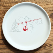 Mountain serving platter with a gondola pattern.