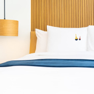 Photo of beacon-pattern pillowcases arranged on a bed.