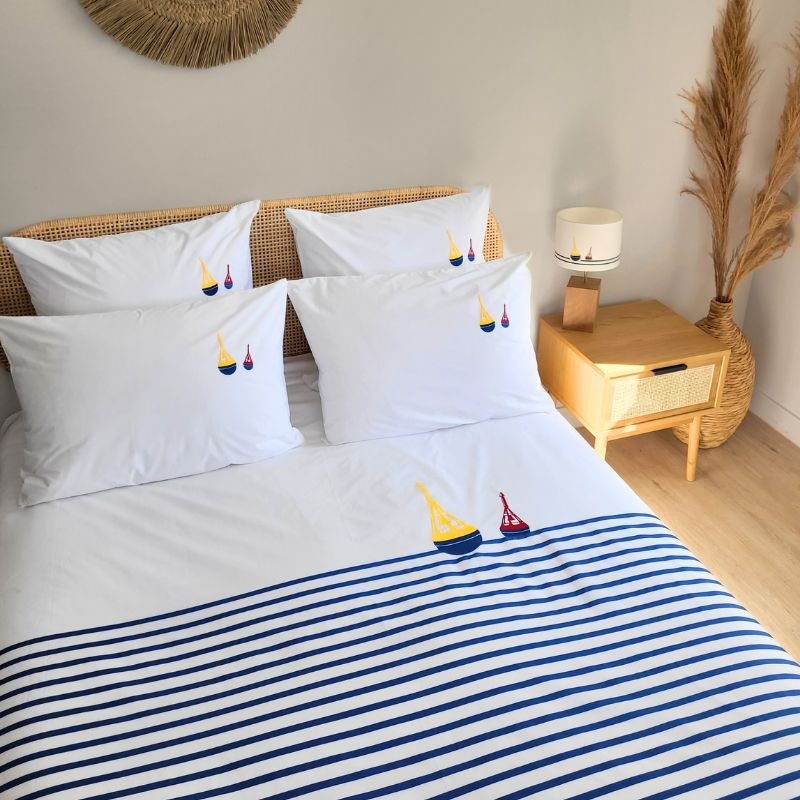Striped seaside duvet cover embroidered with a beacon pattern.