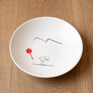 Mountain soup plate with a skier pattern.