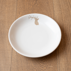 Mountain soup plate with a beige deer pattern.