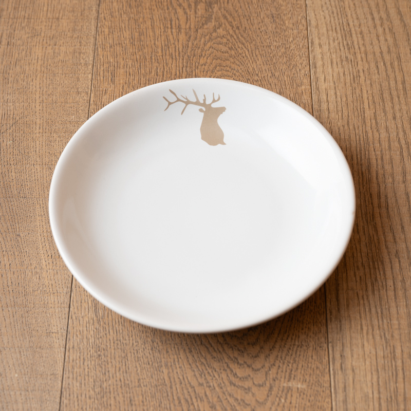 Mountain soup plate with a beige deer pattern.