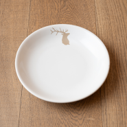 Mountain soup plate with a beige deer pattern.