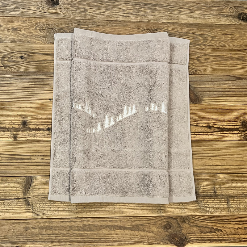 Tappetino da bagno bosco di abeti beige