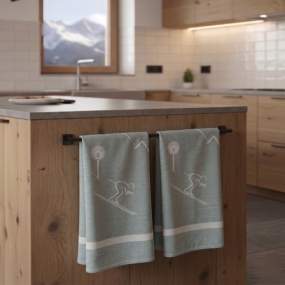 Strofinaccio da montagna verde con un motivo di sciatore in una cucina contemporanea.