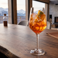 Mountain tasting glass with two ibexes in a mountain chalet setting.