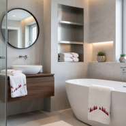 White mountain towel embroidered with red pine trees in a contemporary bathroom.