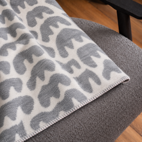 A closer look at the white fir trees on the ski blanket.